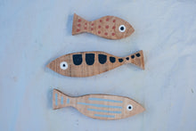 Load image into Gallery viewer, Yr hyn a gwymp, nid yw'n orffenedig: Pysgod pren (set o 3) / What Falls Is Not Finished: Wooden Fish (set of 3)