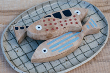 Load image into Gallery viewer, Yr hyn a gwymp, nid yw'n orffenedig: Pysgod pren (set o 3) / What Falls Is Not Finished: Wooden Fish (set of 3)
