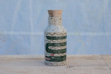 Load image into Gallery viewer, Yr hyn a gwymp, nid yw'n orffenedig: Potel Rym a Biceri / What Falls Is Not Finished: Rum bottle and Beakers
