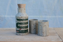 Load image into Gallery viewer, Yr hyn a gwymp, nid yw'n orffenedig: Potel Rym a Biceri / What Falls Is Not Finished: Rum bottle and Beakers
